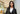 Elegant woman in a custom black 3-piece suit tailored from Vitale Barberis Canonico fabric, designed for modern sophistication
