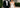 Bride and groom in custom black tuxedo and wedding gown outside Columbia South Carolina wedding venue