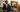 well dressed man in lightweight navy suit at an upscale outdoor Southern wedding during golden hour